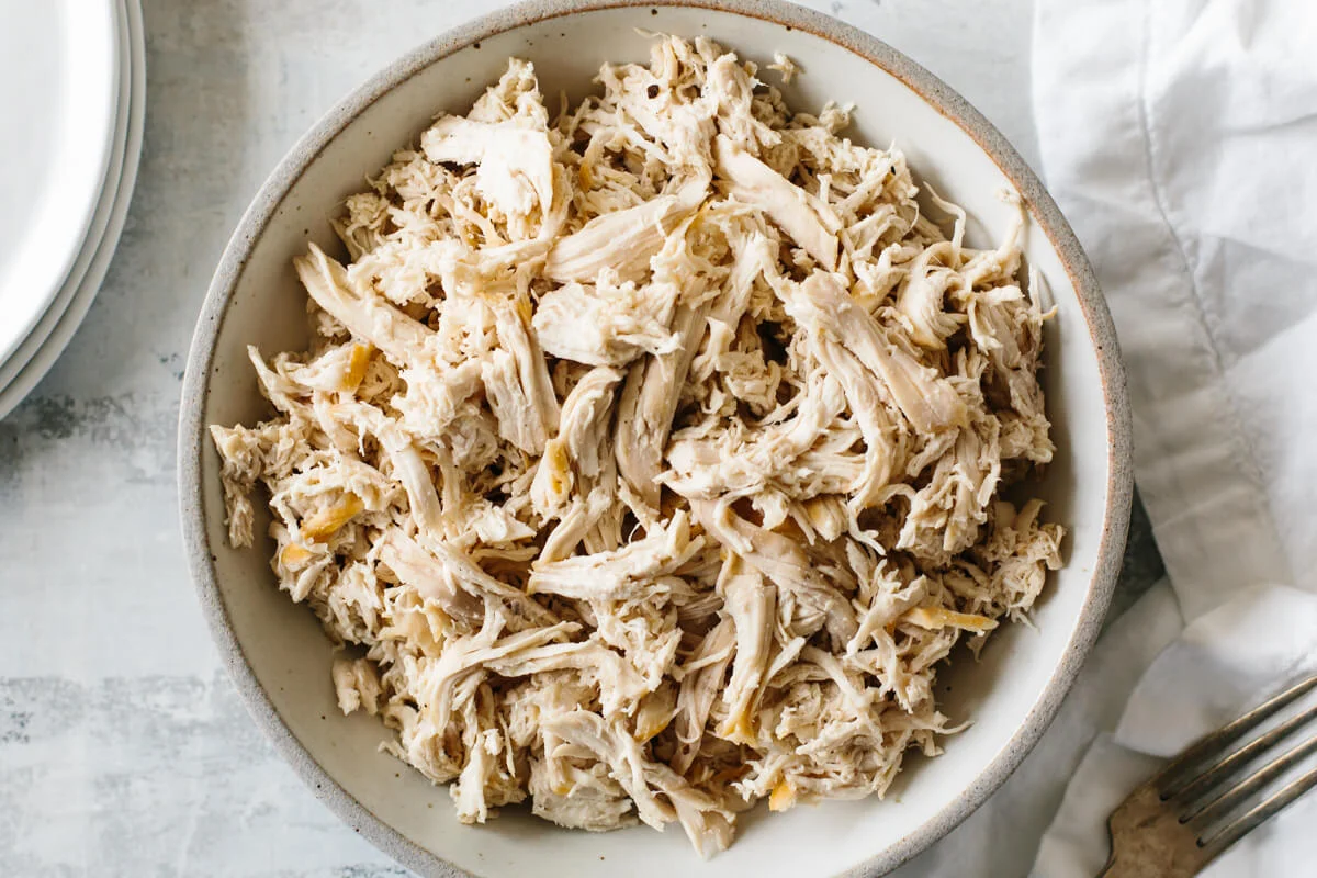 Tender oven roasted chicken breast prepared in shredded pieces